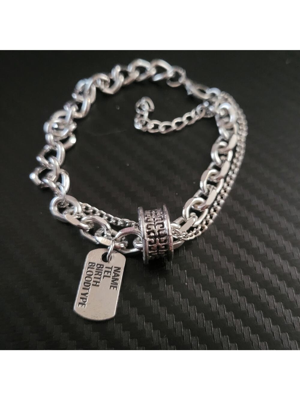 Chunky layered silver tone chain bracelet with dog tag charm